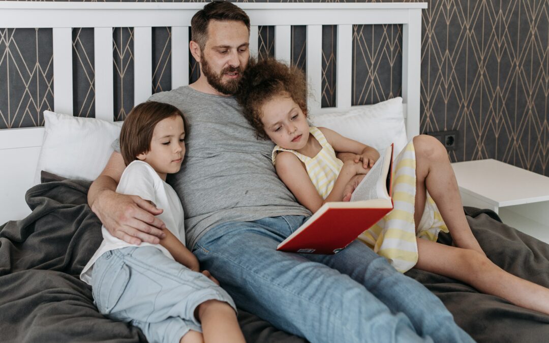 dad reading to daughters