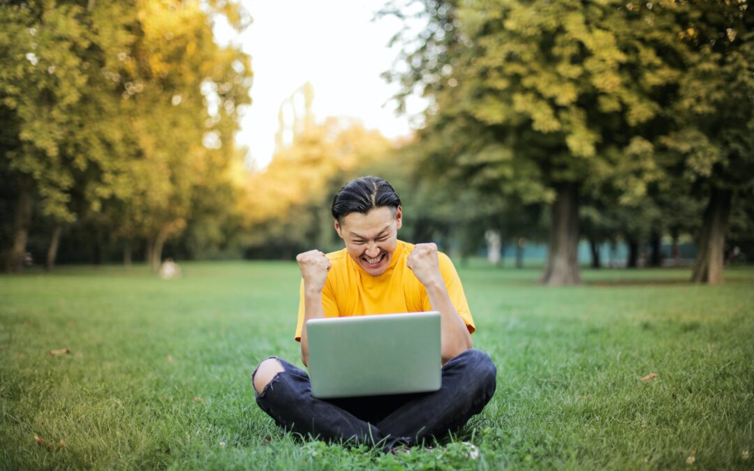 homeschool teen in field with laptop