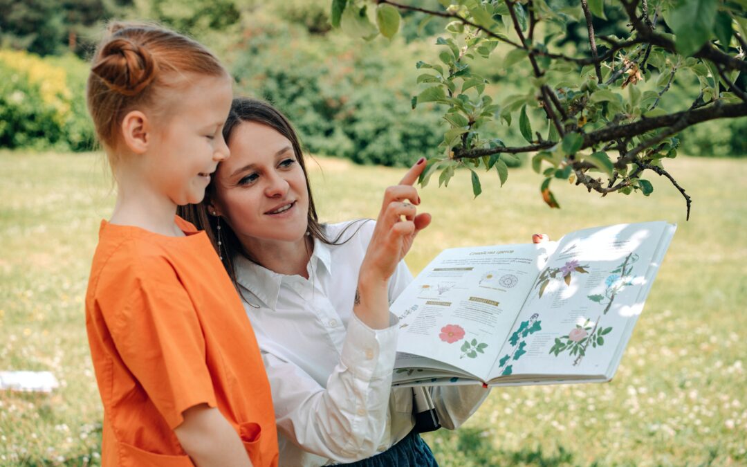 mom and daughter studying tree