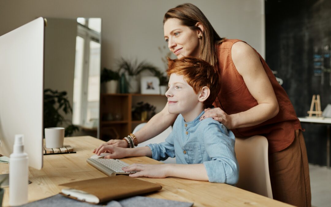 homeschool mom helping son with online classes