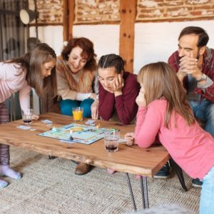 a family playing a game board