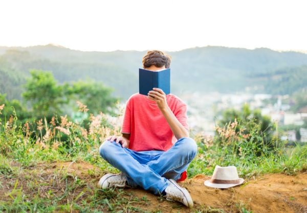 a kid reading his book