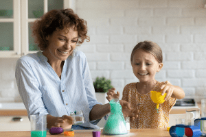 mom & daughter kitchen table science experiement