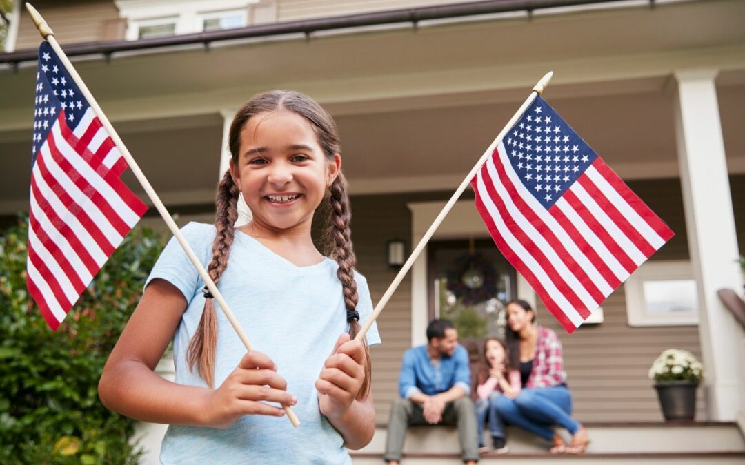 Girl with american flag with catholic homeschool family