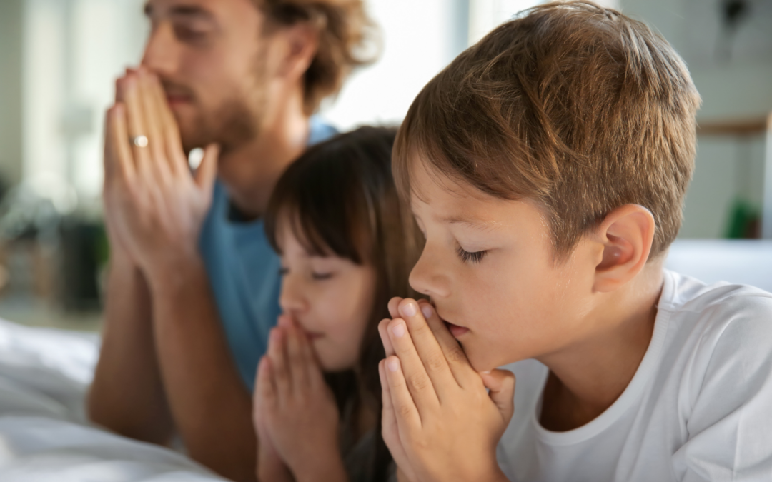 Praying family at bedside