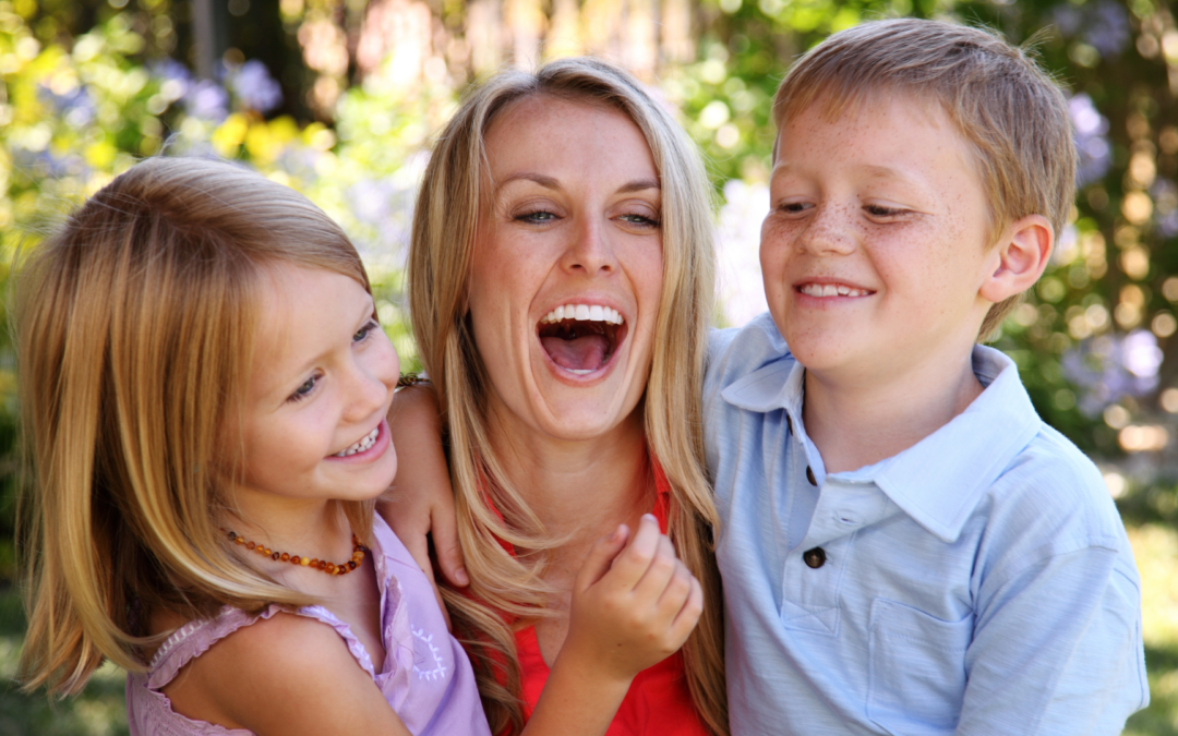 Catholic homeschool mom laughing with children