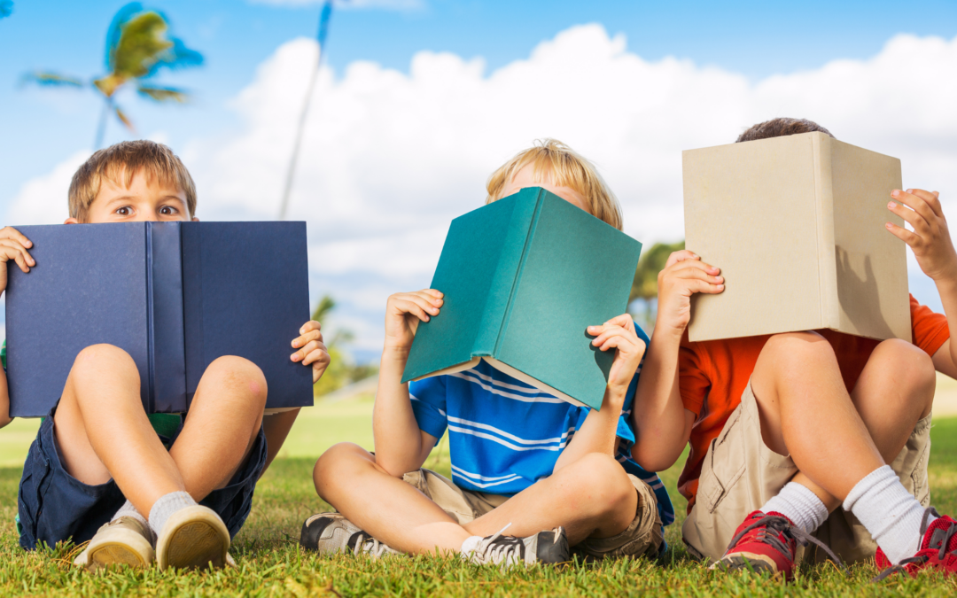 Children reading on summer day