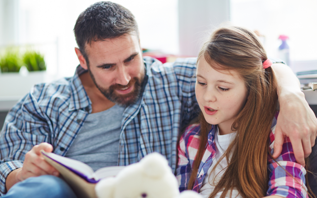 catholic homeschool dad reading aloud to daughter