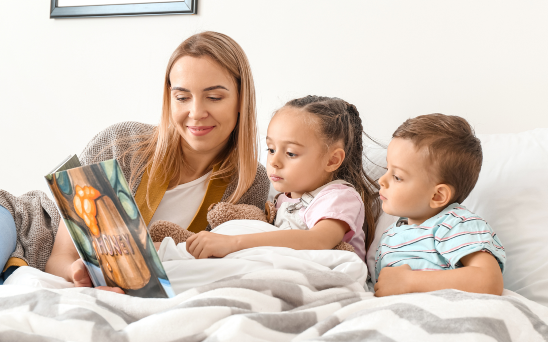 catholic homeschool mom reading aloud to her children at bedtime