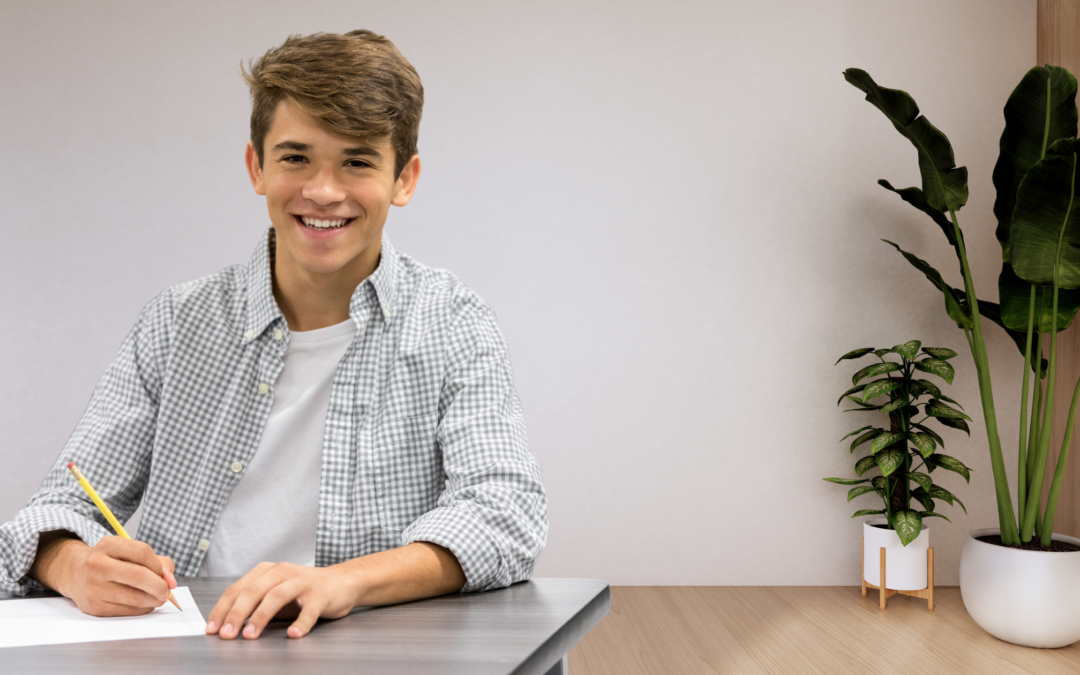 homeschool boy writing at desk