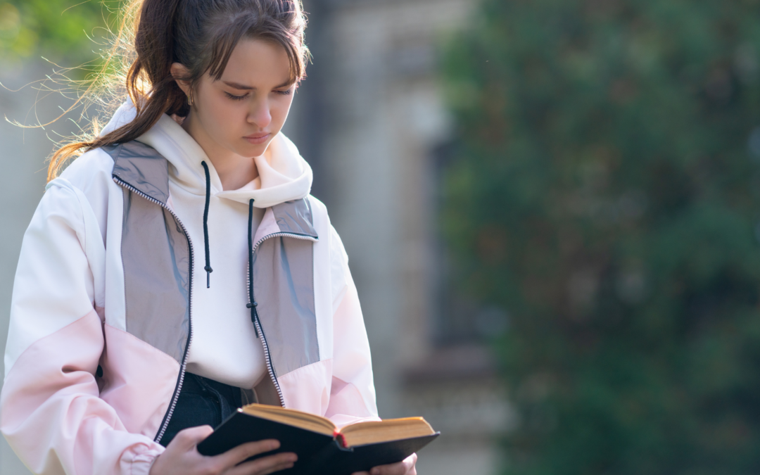 catholic homeschool teen reading in solitude