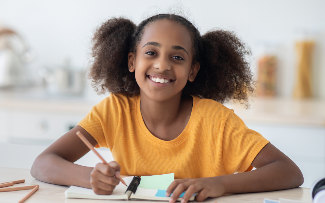 catholic homeschool teen writing in planner