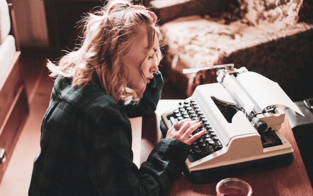 catholic homeschool teen girl writing at typewriter