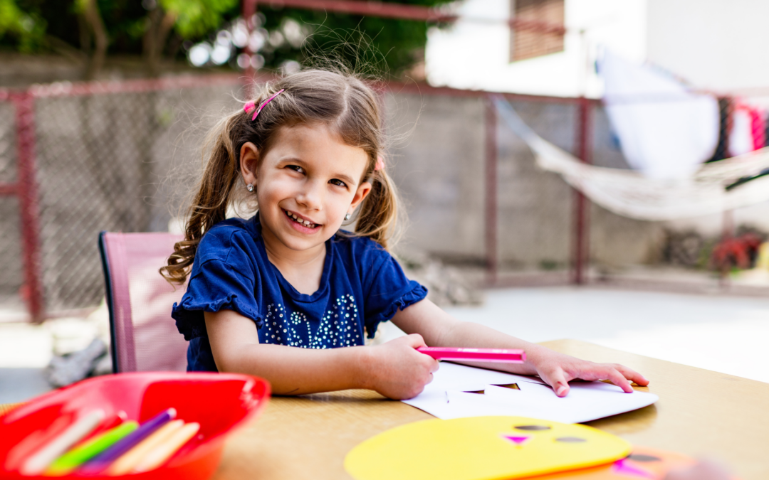 catholic homeschool girl doing school work outside