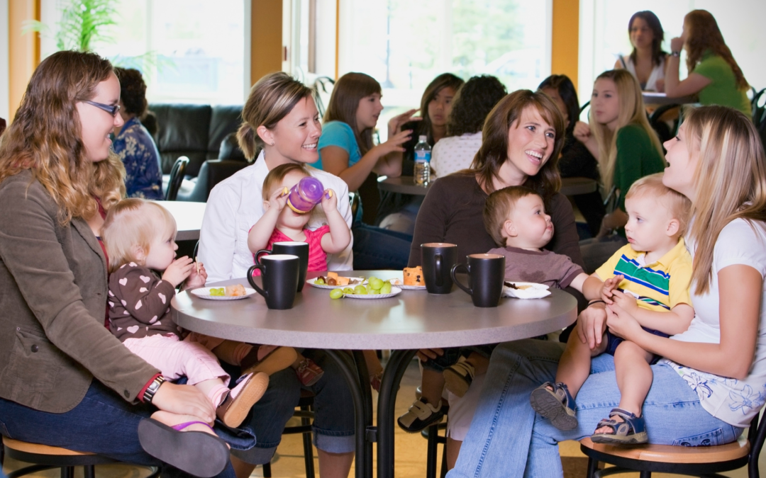 catholic homeschool moms talking over coffee with babies