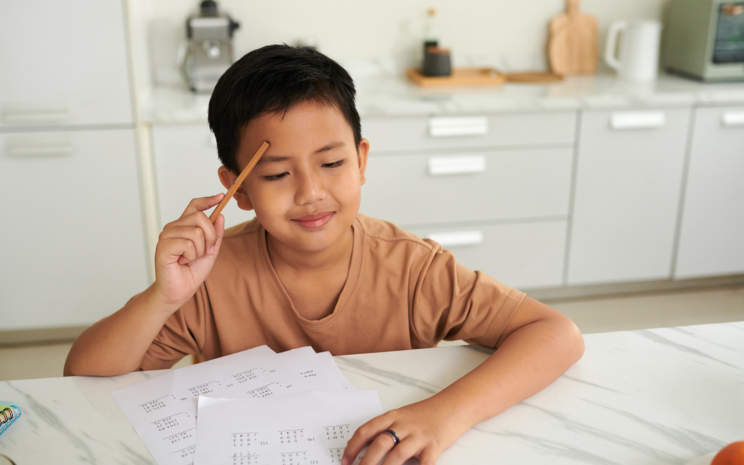 catholic homeschool boy working on math problems