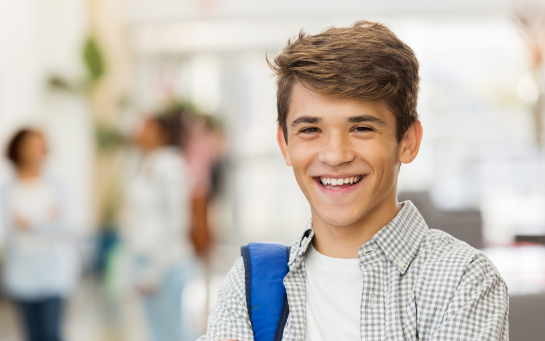 Catholic homeschool teen boy smiling at the camera