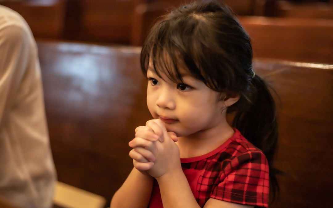 Catholic homeschool girl praying
